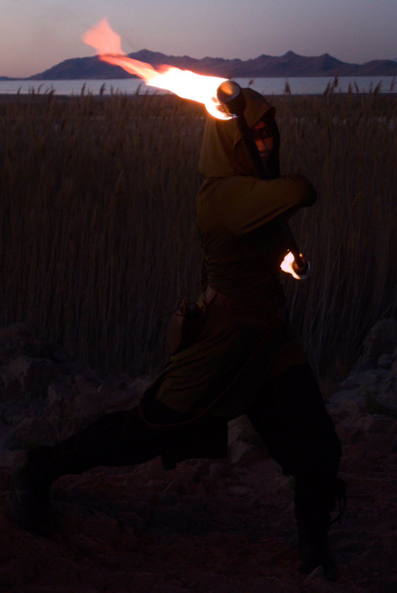 Fire staff performance at dusk